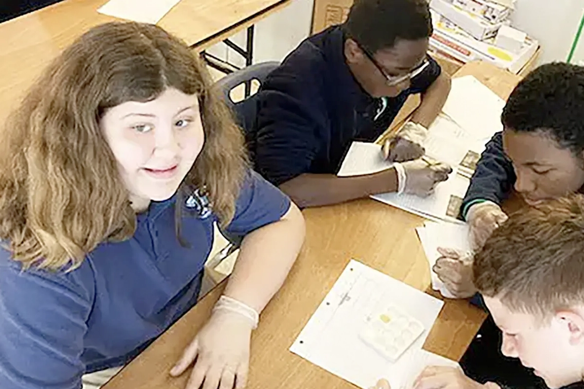 A group of eighth grade Banner students studying chemical reactions. 